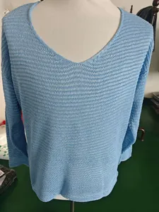 Detail of light blue V-neck knit sweater featuring breathable hollow mesh texture
