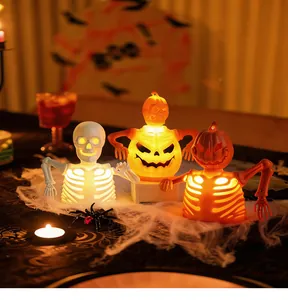 Glow-in-the-dark skeleton and pumpkin figurines for spooky Halloween party decor