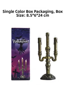 Three-head skeleton candle holder with bronze finish and LED flames in a purple gift box
