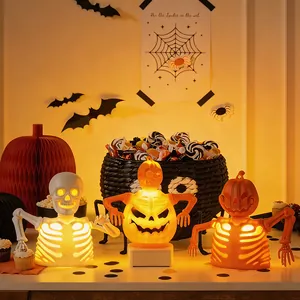 Halloween LED skeleton and pumpkin lantern decorations with warm yellow glow
