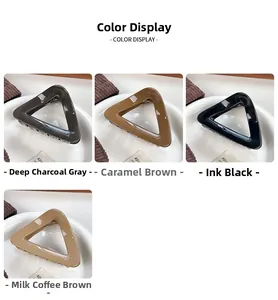Detailed color display of large triangle hair claws in charcoal, brown, black, and beige
