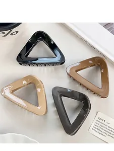 Minimalist hollow triangle hair claws in black, beige, caramel, and grey colors