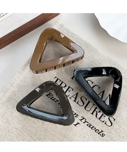Three-piece set of large triangular hollow hair claws in black, brown, and grey colors