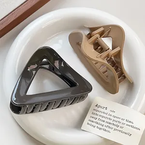 Minimalist triangle hair claws in black and khaki, glossy finish shark clips for women