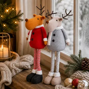 Macro detail of red and grey plush Christmas reindeer with striped knitted long legs