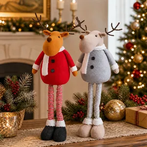 Detail of plush Christmas reindeer dolls with telescopic legs in red and gray holiday outfits