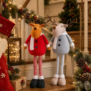 Detail of Christmas reindeer plush dolls with retractable legs on a festive staircase