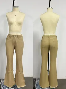 Detail of high waist khaki flare pants with button closure and raw hem finish