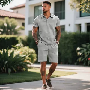 Men's grey waffle knit two-piece set with polo shirt and drawstring shorts