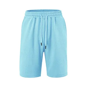 Men's light blue casual shorts with waffle texture and adjustable drawstring waist