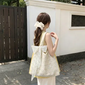 Floral canvas tote bag with white lace bow detail and matching hair scrunchie set