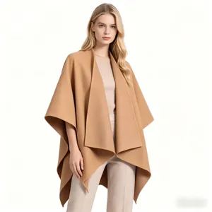 Detail of tan wool blend shawl coat featuring wide lapels and soft textured fabric