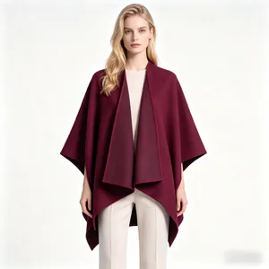 Detail of burgundy thick shawl cape for women with fine stitching and textured fabric