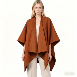 Close-up of elegant caramel brown shawl coat with premium stitching and soft drape