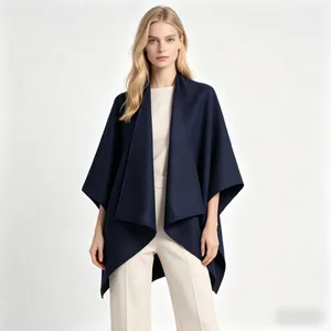 Detail of elegant navy blue thick shawl coat featuring asymmetric geometric hemline