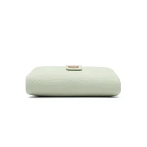 Detail view of mint green wallet with lychee grain texture and gold metal snap button