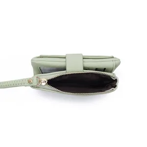 Detail view of mint green litchi texture PU leather wallet with card slots and zip