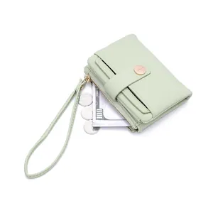 Close-up of mint green litchi grain small wallet featuring card slots and coin zipper