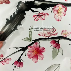 Detail showing adhesive backing and removable transparent floral wall sticker material
