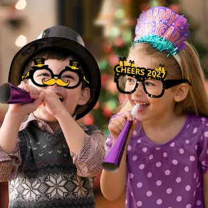 Children celebrating with 2027 Happy New Year party glasses and holiday headbands