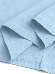 Macro shot showing high-quality stitching and breathable linen fabric texture of blue polo