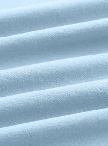 Close-up of light blue linen texture and breathable woven fabric for men polo shirt