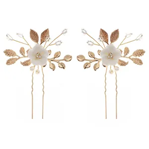 Elegant gold leaf and pearl bridal hair pin set with white ceramic flower details