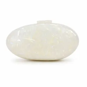 Macro detail of oval acrylic clutch with iridescent shell texture and smooth finish