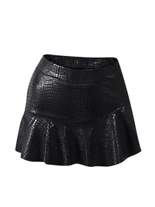 Detail of high-waisted black faux crocodile leather skirt with textured glossy finish