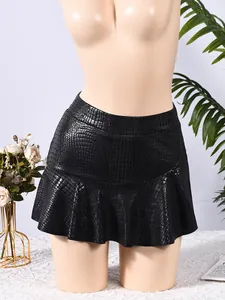 Detailed macro view of black crocodile textured PU leather skirt with ruffled hem