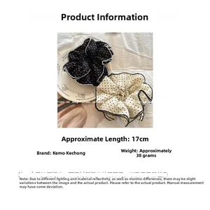 Detailed view of black and white polka dot scrunchie size 17cm and weight 38g