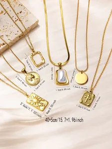 Detailed view of various gold-plated stainless steel pendants on silk background