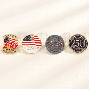 Detailed close-up of four American 250th anniversary enamel pins on textured fabric