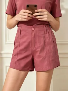 Women's vintage high waist cargo denim shorts in deep mauve with utility pockets
