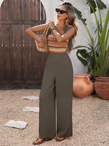 Close-up of bohemian geometric knit bodice with self-tie straps and olive wide-leg pants