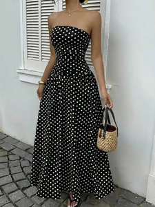 Elegant black and white polka dot strapless maxi dress with a flattering slim waist