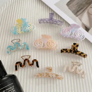 Set of nine diverse graffiti pattern large hair claws with marble and tortoiseshell finish