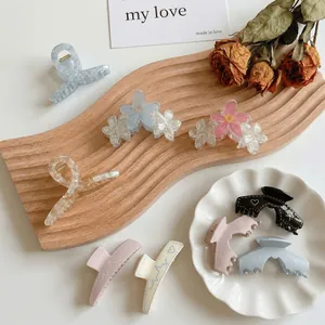 Graffiti trapezoid claw clips with floral and marble patterns for elegant hair styling