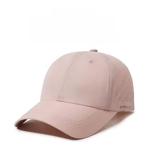 Detail view of pink baseball cap with triangle side laser-cut ventilation holes