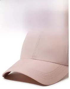 Close-up of pink baseball cap brim showing detailed stitching and durable fabric texture