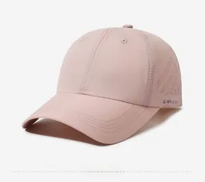 Close-up of lightweight pink golf cap with laser-cut ventilation holes and GLWR logo