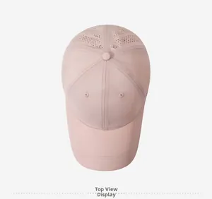 Top view of pink quick-dry baseball cap featuring breathable laser-cut holes on panels