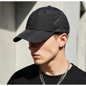 Detail of black quick-dry golf cap with GLWR GOLF logo and adjustable drawstring