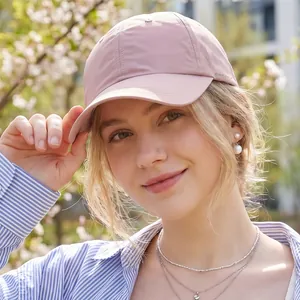 Pink quick-dry baseball cap with GLWR GOLF logo and breathable laser-cut holes