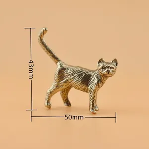 Macro view of vintage brass cat figurine showing 43mm height and 50mm length