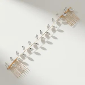 Elegant gold bridal hair vine with crystal leaf design and dual metal combs for hair styling