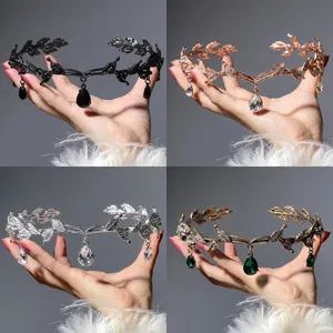 Macro shot showing four color variants of vintage leaf tiaras with crystal pendants