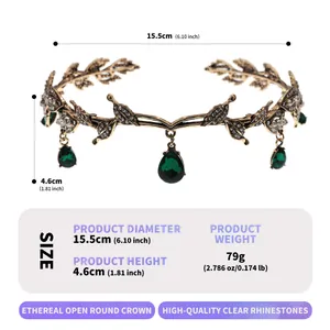 Detail view of vintage gold bridal crown with green gems and leaf decorations