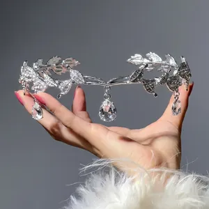 Elegant silver leaf crown with rhinestones and teardrop pendants for wedding hairstyles