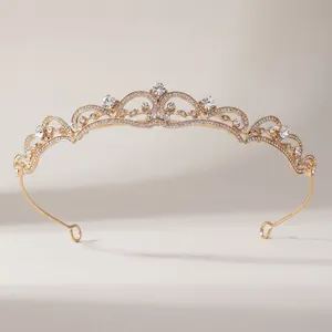 Macro detail of rose gold bridal crown featuring intricate filigree and crystal inlay